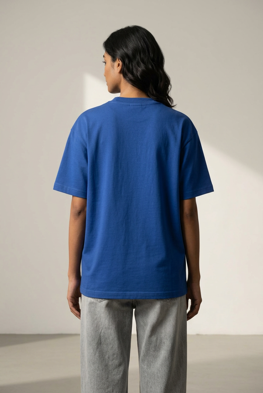 Female plain back of royal blue Aura tee
