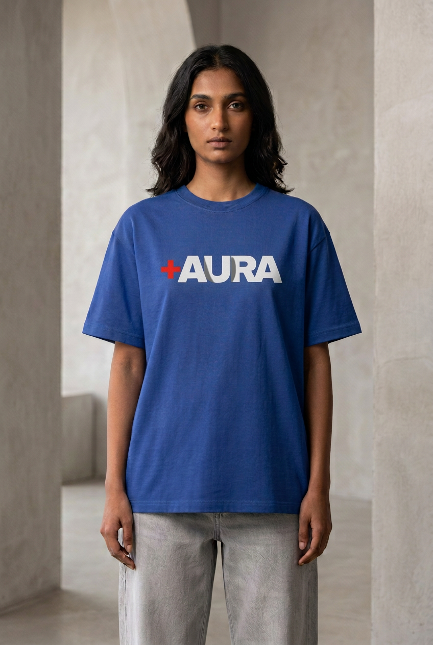 Female front wearing royal blue Aura graphic tee, corrected sharp image