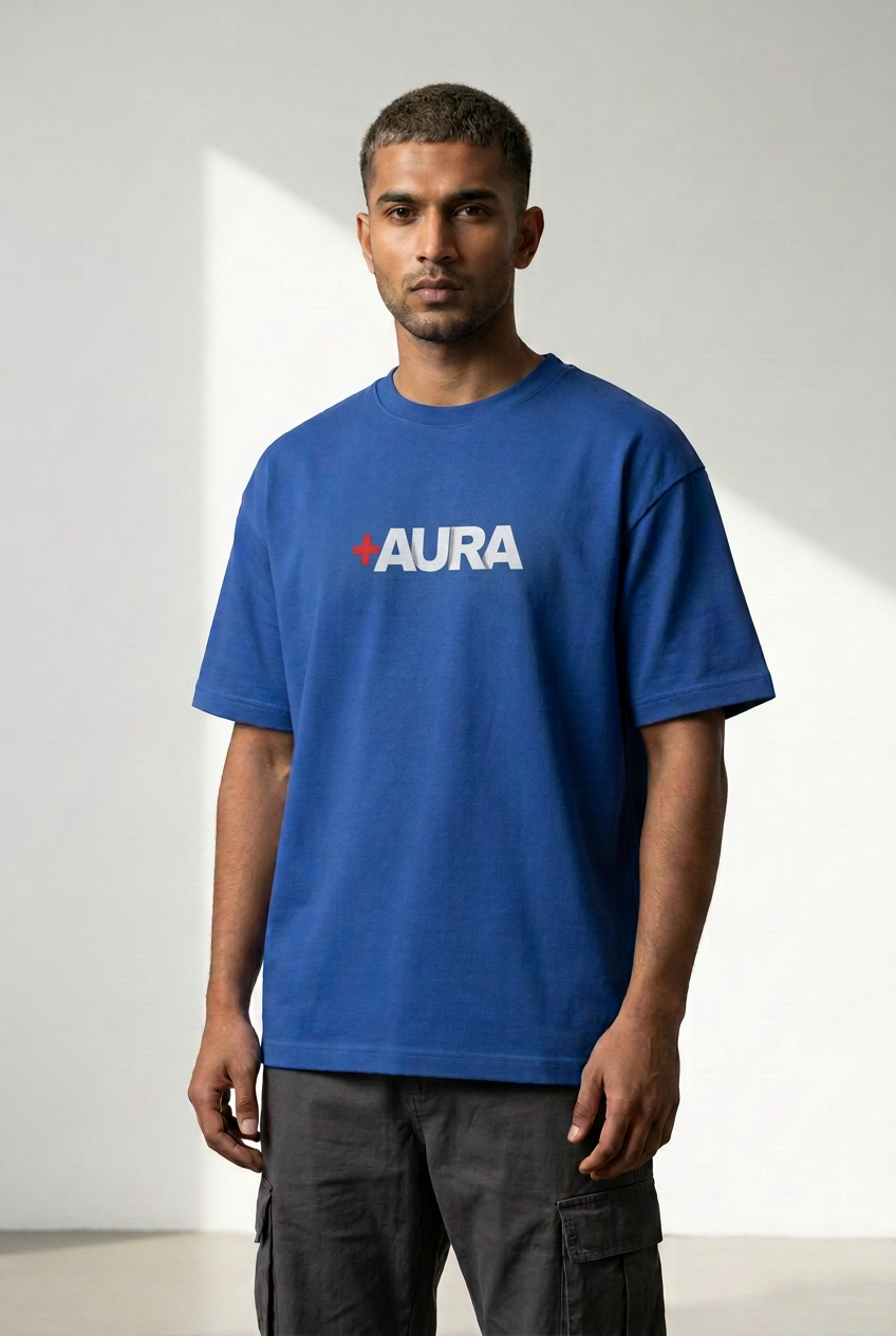 Male front wearing royal blue Aura graphic tee